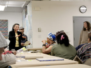 Deaf refugees from ‘Deaf New American Advocacy Inc.’ create clay mandala’s inspired by Neil Tetkowski’s sculpture the ‘World Mandala’ which consists of combining clay from 188 member countries of the UN together. 