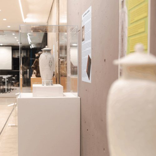 The 3D printed model sits next to the real "Scarab Vase" in the Everson's Ceramics Gallery