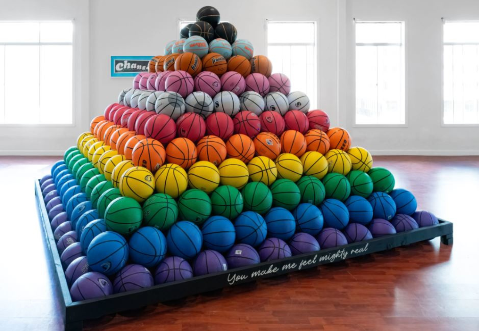 A pyramid of painted basketballs